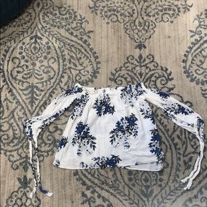 Off the shoulder shirt with ties at the bottom